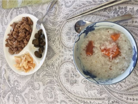 Beautiful guest breakfast submission, appears to be coconut flakes, persimmon, wheat porridge
